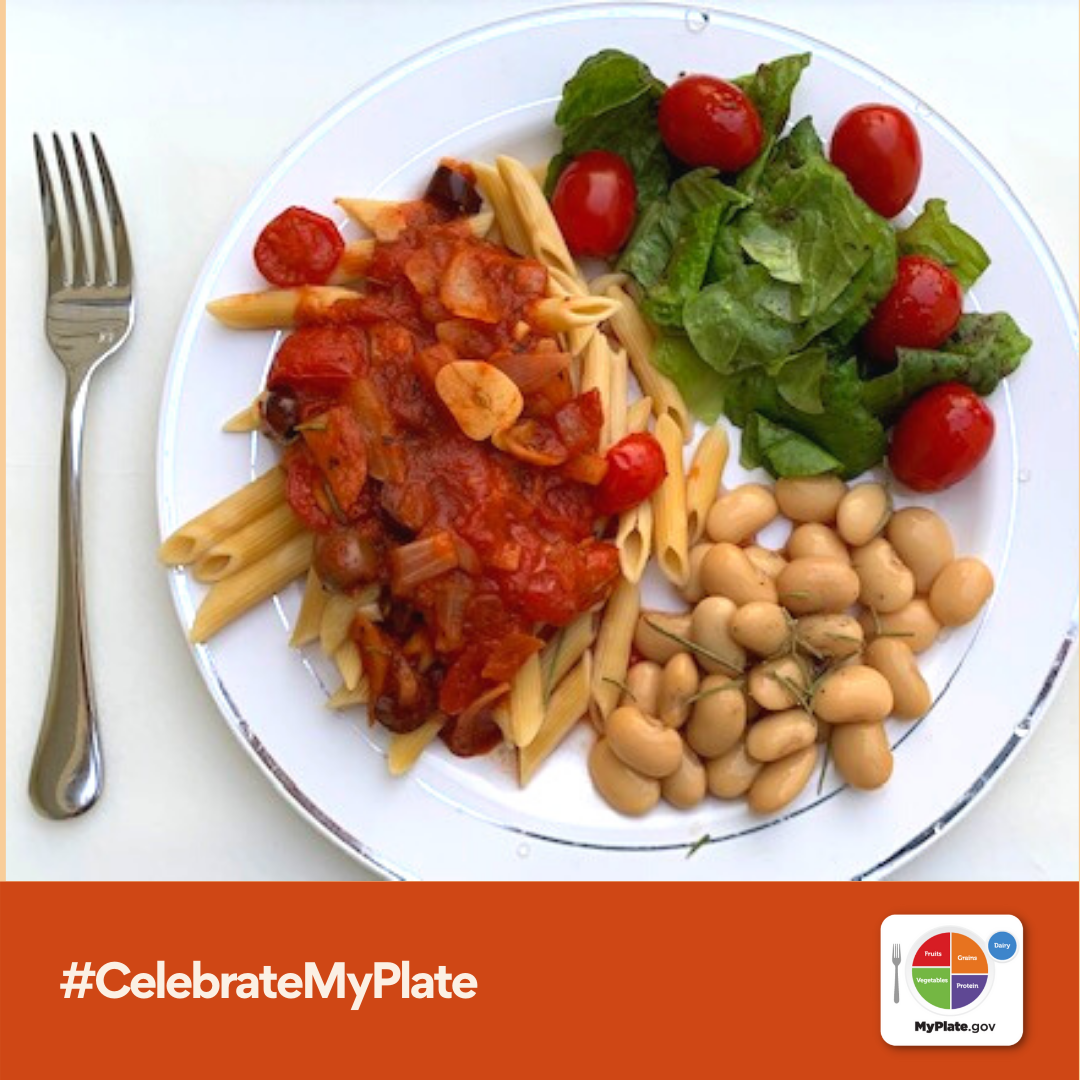 plate of pasta, chickpeas, and salad
