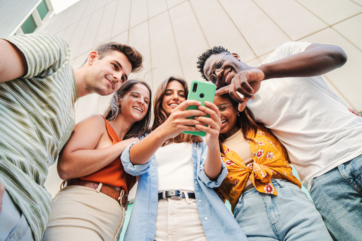 Friends looking at a phone