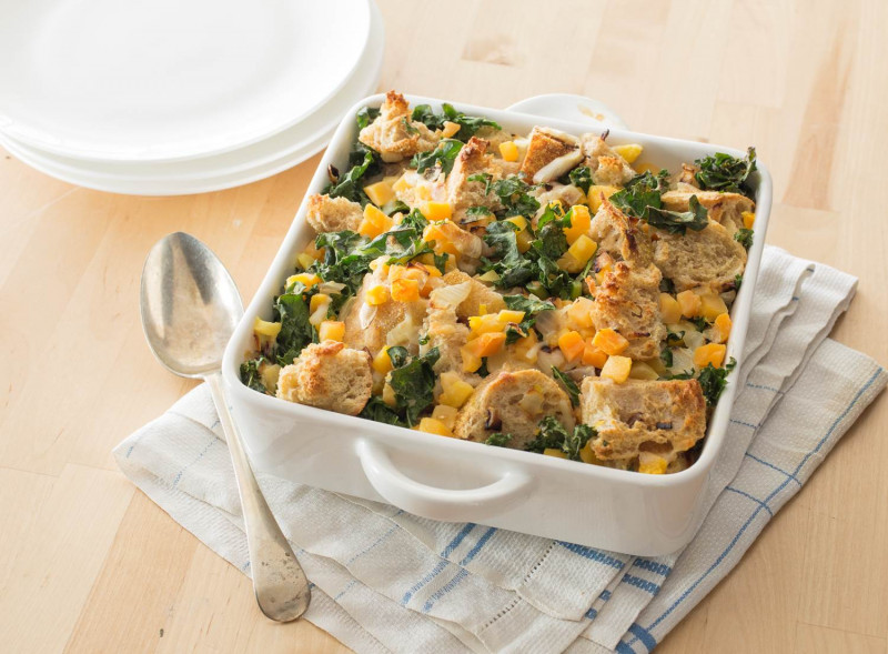 Savory Bread Pudding with Kale and Butternut Squash in a serving dish