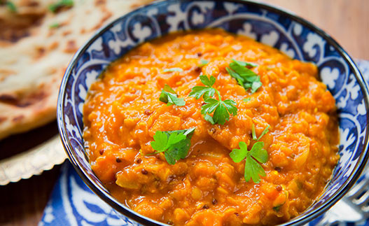Masur Dal (Red Lentils with Onion) in a bowl