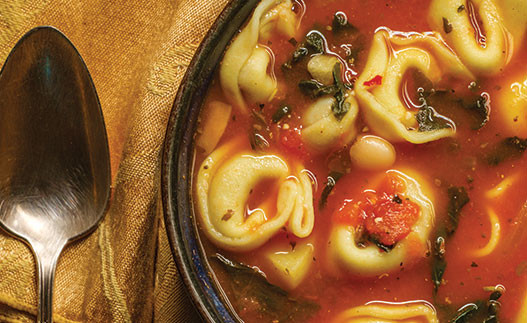 image of tortellini soup in a bowl