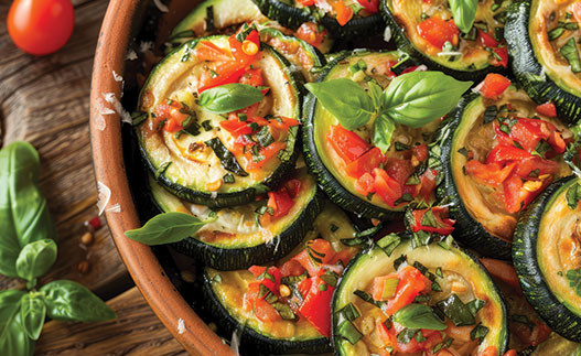 image of zucchini and tomatoes in a serving dish