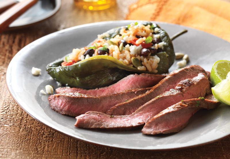 image of Lime-Marinated Flank Steak with Stuffed Poblano Peppers on a plate