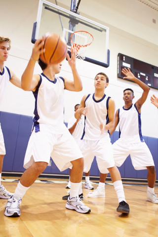 young boys playing basketball