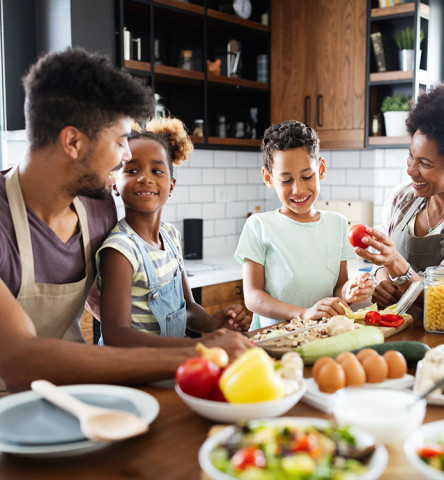 black family cooking together