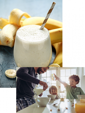 smoothie in a glass with a straw and a father pouring milk for kids breakfast bowls