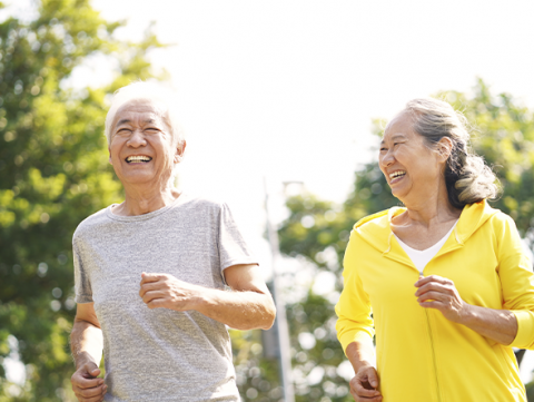 asian male and female older adults jogging