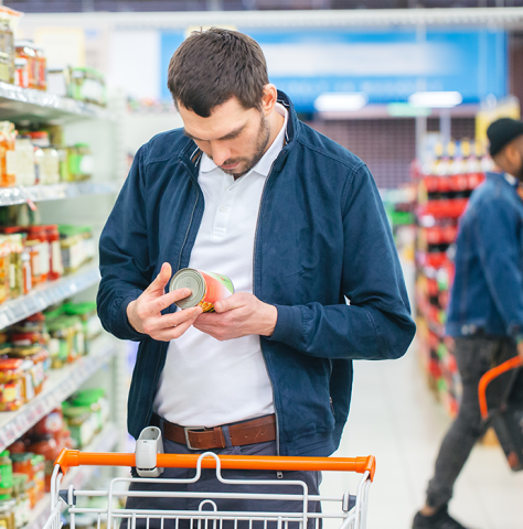 white male looking at label grocery store