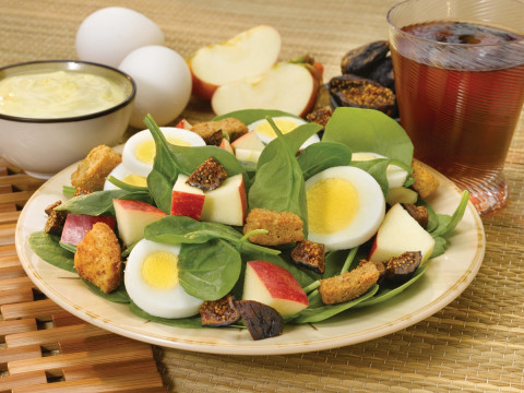 Spinach Salad with Apples and Eggs on a plate