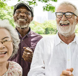 3 older adults laughing and happy