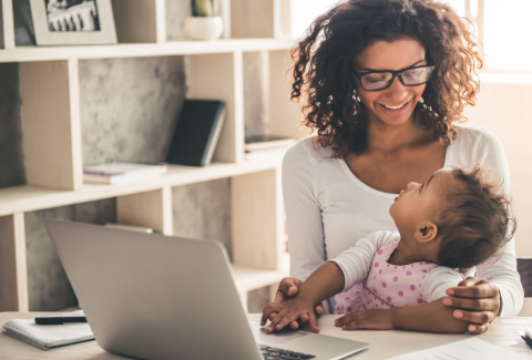 image of a mother and her toddler looking at the MyPlate.gov website on a laptop