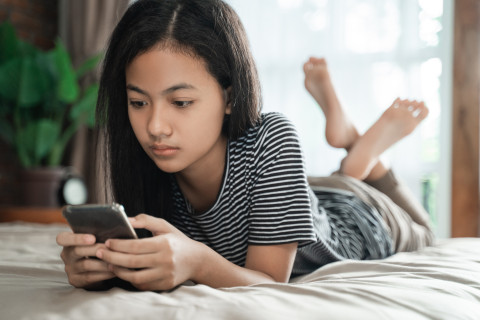 Teen girl using a smartphone