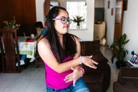 Teen girl dancing at home