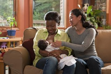 Breastfeeding person with baby