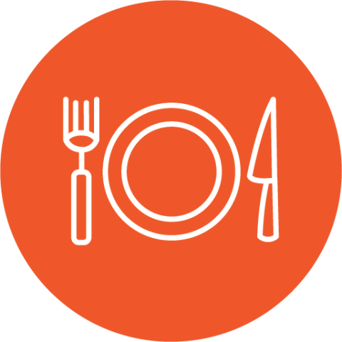 Plate and silverware on an orange background