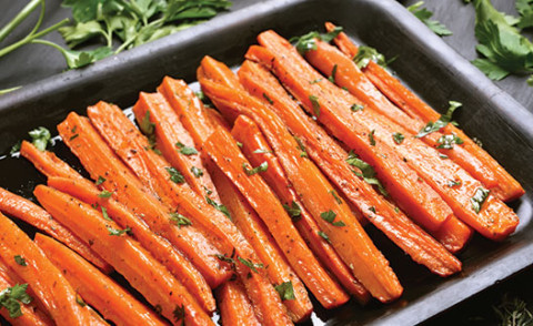 image of zesty orange carrots in a tray