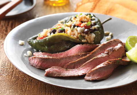 image of Lime-Marinated Flank Steak with Stuffed Poblano Peppers on a plate