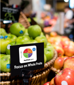 Grocery sign to focus on whole fruits