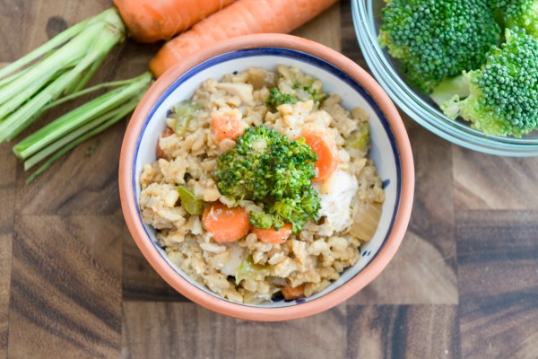 Fried rice topped with vegetables in a bowl