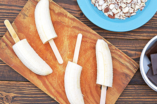Frozen Banana Pops on a cutting board