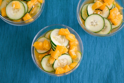 cucumber and orange salad in a bowl