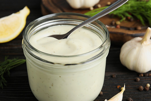 a jar of creamy italian herb dressing