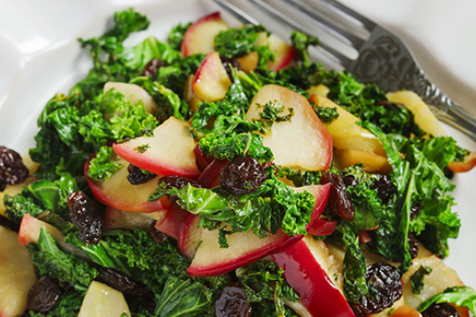 Spinach Salad with Apples and Raisins on a plate