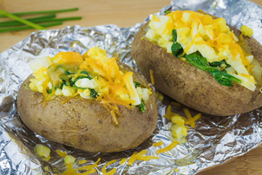 Spinach Stuffed Potatoes on a sheet of aluminum foil