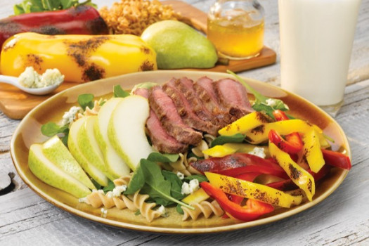 Grilled Steak and Peppers Salad with Pears on a plate