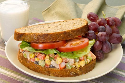 Shrimp Confetti Salad Sandwich with Grapes on a plate