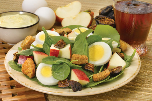 Spinach Salad with Apples and Eggs on a plate