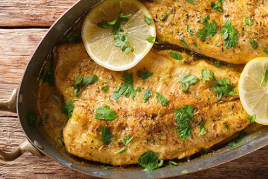 Mouth-Watering Oven-Fried Fish in a skillet