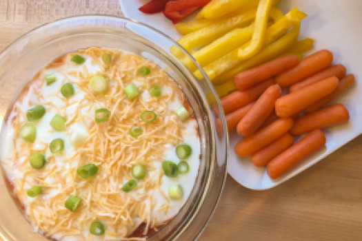 Layered Black Bean Dip in a bowl