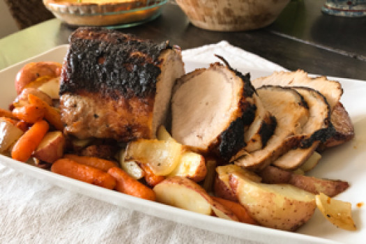 Pork Loin Roast with Veggies on a platter