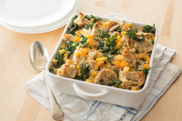 Savory Bread Pudding with Kale and Butternut Squash in a serving dish