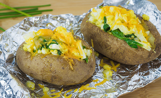 Spinach Stuffed Potatoes on a sheet of aluminum foil