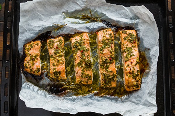 Baked salmon with herbs and lemon fresh out of the oven