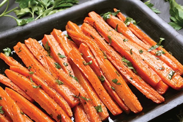 image of zesty orange carrots in a tray