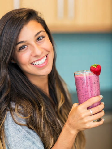 picture of a teenage girl holding a smoothie