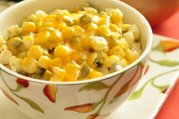 Bowl of chili cheese hominy